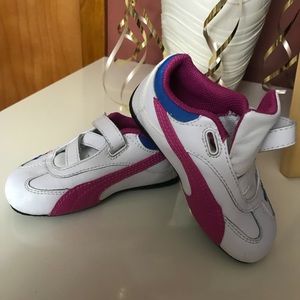 A pair of Kids Puma Sneakers